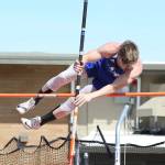 Billy Rankins clears the bar in the pole vault,(Photo by John Fisken)