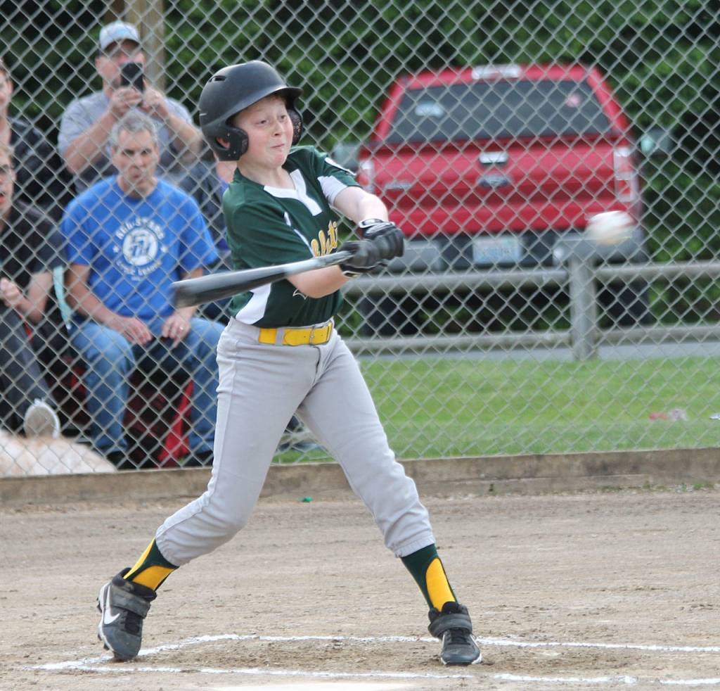 Cohan Criswell attacks a pitch in Wednesdays game.(Photo by Jim Waller/South Whidbey Record)