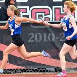 Mattason Straub, right, hands the baton to Mallory Drye.(Photo by Karen Swegler)