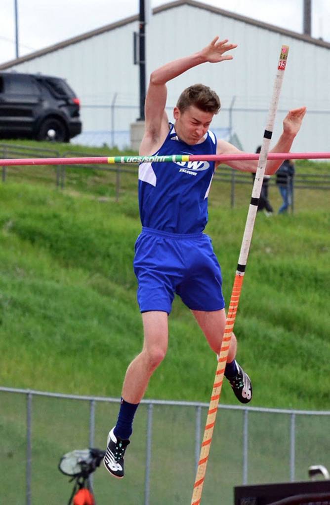 Sam Martin clears the bar in the pole vault.(Photo by Karen Swegler)