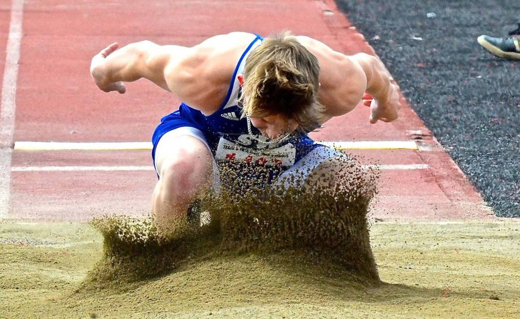 Billy Rankin sticks the landing in the long jump.(Photo by Karen Swegler)
