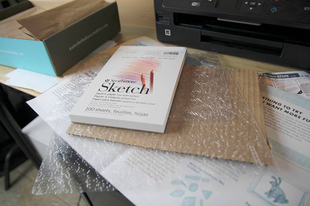 A variety of tools and art supplies come in each box.