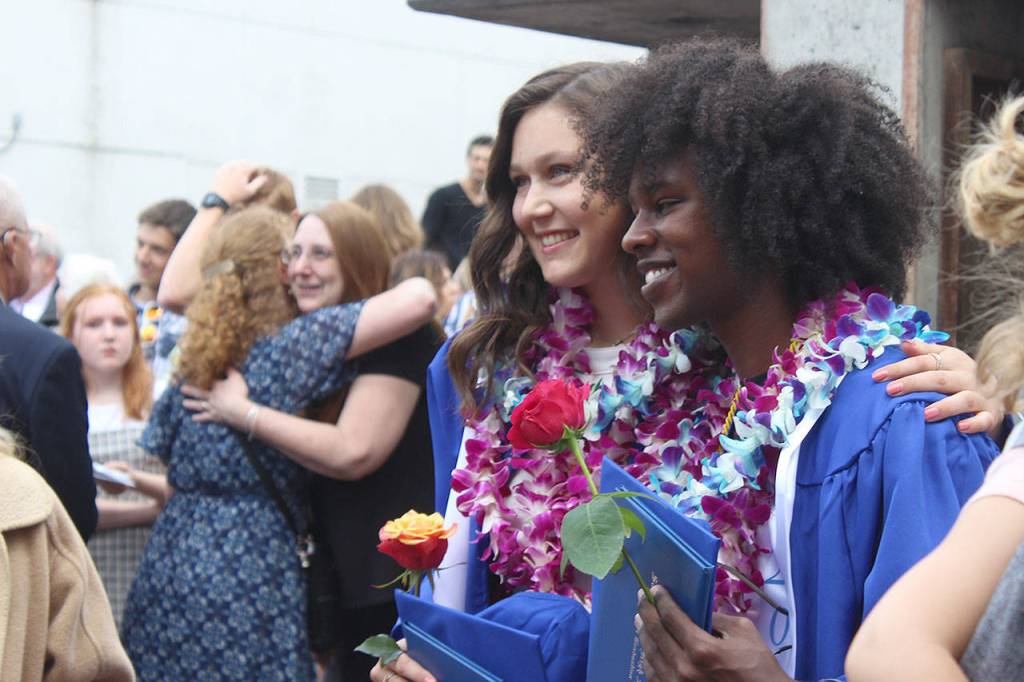 Elizabeth Michelle Simmons poses with her brother, Matthew Simmons, who spoke about being adopted, perceptions and self-reliance during his speech as class choice speaker. Both graduated Saturday from South Whidbey High School. Photo by Patricia Guthrie/Whidbey News Group