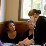 Tables are turned on the three sisters of the Freeland Cafe as they stop in as customers. Petite Bryant-Hunt, far left, Dawn Swamp and Lani Bryant-Anderson recently sold the popular diner that their parents opened in 1974. Photo by Patricia Guthrie/Whidbey News Group