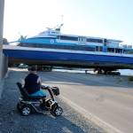 Jake Johnson watches as a San Francisco ferry moves slowly out of the water toward Nichols Brother Boat Builders at Holmes Harbor. The vessel is in for repairs, one of several the Freeland boatyard has worked on for Golden Gate Bridge fast ferries over the years. Photo by Patricia Guthrie/Whidbey News Group