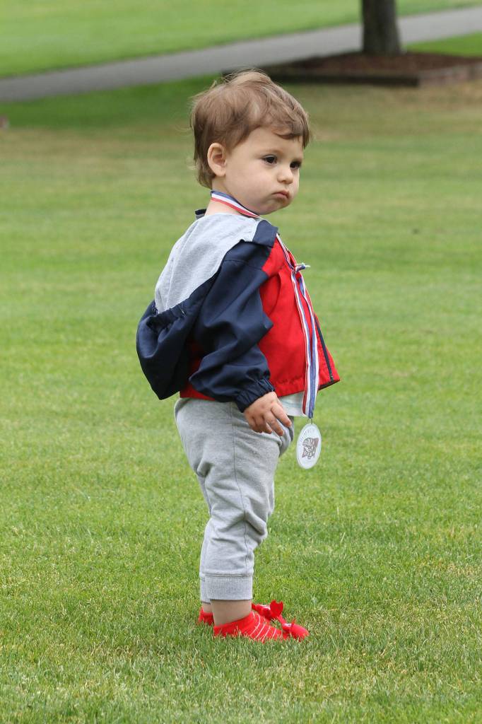 Edgar Anthony Trevino shows off his Fry Run medal and fancy footwear.(Photo by Jim Waller/South Whidbey Record)