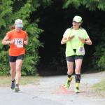Trisha Hallgren, left, and Joani Wright run the course together.(Photo by Jim Waller/South Whidbey Record)