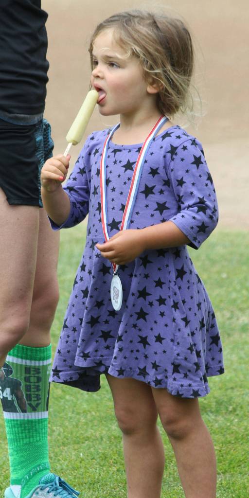 Sylvie Horton enjoys a treat after completing the Fry Run.(Photo by Jim Waller/South Whidbey Record)