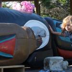 Jaymz Jarvis of Oak Harbor gets a closer look at the totem pole, taking a moment to touch the carved wood. He said hearing about the orca made him sad.