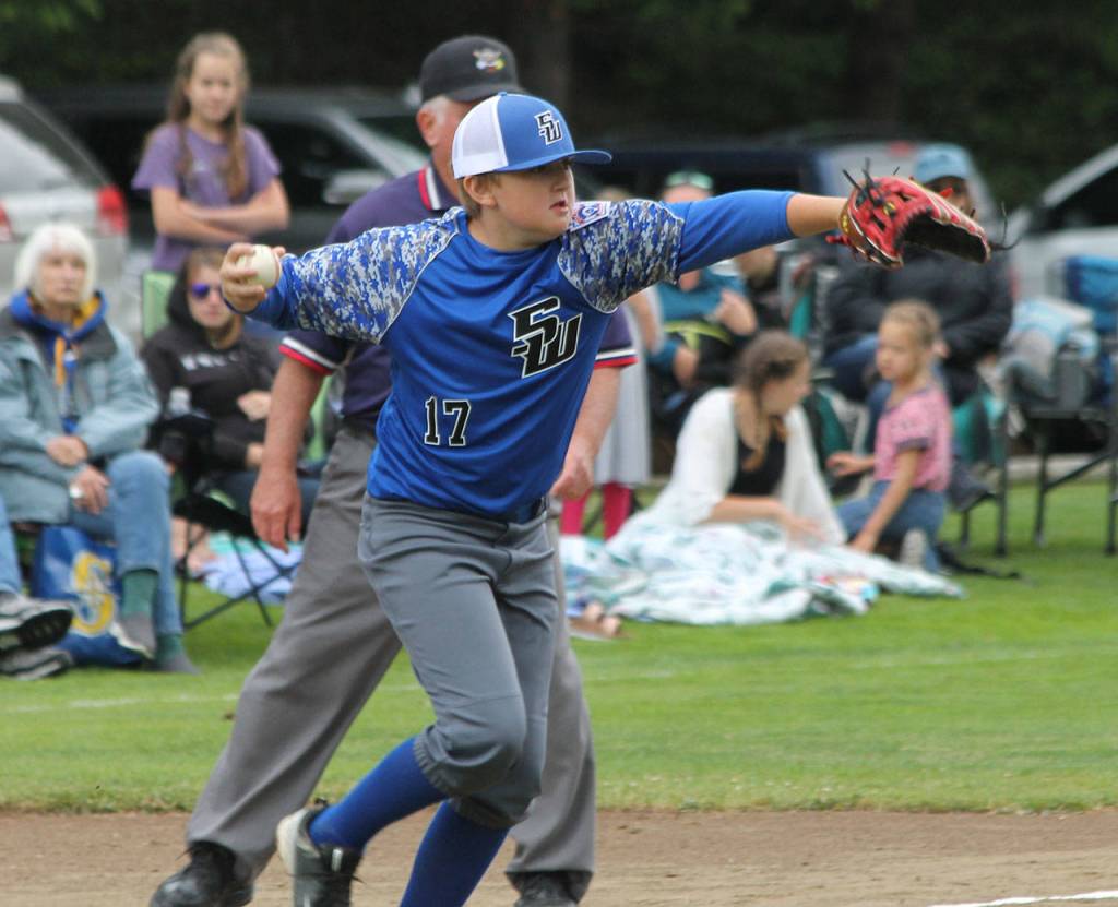 Levi Batchelor prepares to throw to second during a rundown Sunday. (Photo by Jim Waller/South Whidbey Record)