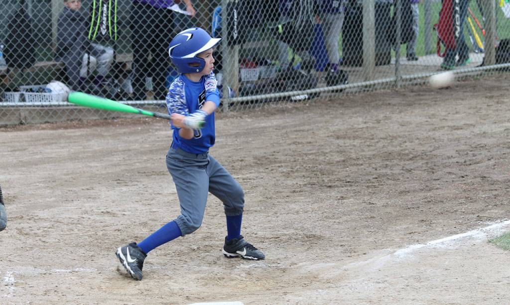 Aeden Fisher takes a cut at a pitch.(Photo by Jim Waller/South Whidbey Record)