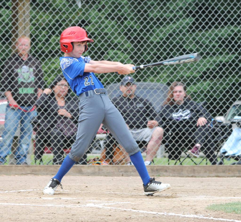 Collier Honold raps a base hit for South Whidbey.(Photo by Jim Waller/South Whidbey Record)