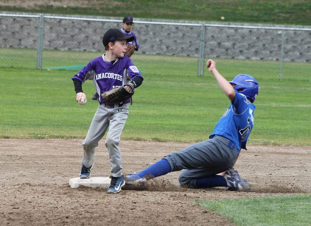John Nienhuis slides into second base for South Whidbey.(Photo by Jim Waller/South Whidbey Record)