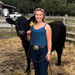 Camden Miller with her steer, Jimmy. Miller purchased Jimmy in December when he was 6 months old. In past years, Miller participated in various 4-H classes at the fair with her horses and is excited to try something new this year, she said. (Photo provided)