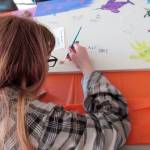 Picnic attendees created a community art canvas. (Photos provided)