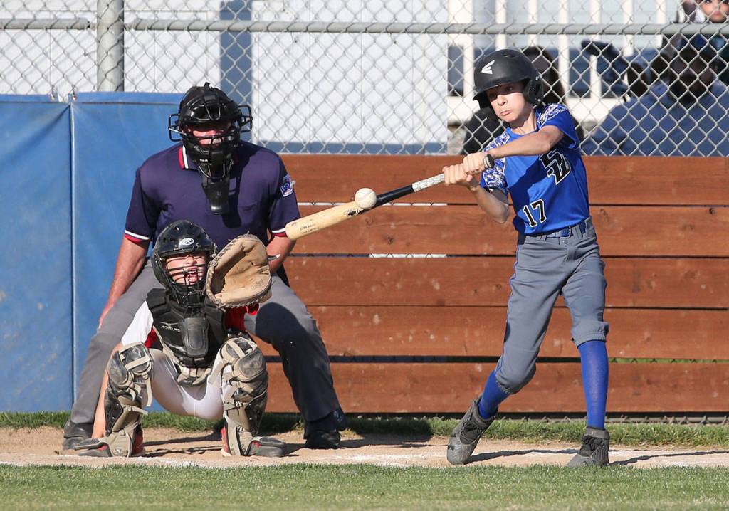 Malachi Pierson drives the ball for a base hit.(Photo by John Fisken)
