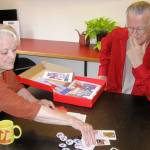 Photos by Dave Felice / South Whidbey Record                                At the Giraffe Heroes Project office in Langley, co-leaders Ann Medlock and John Graham discuss contents of a resource kit for elementary schools.