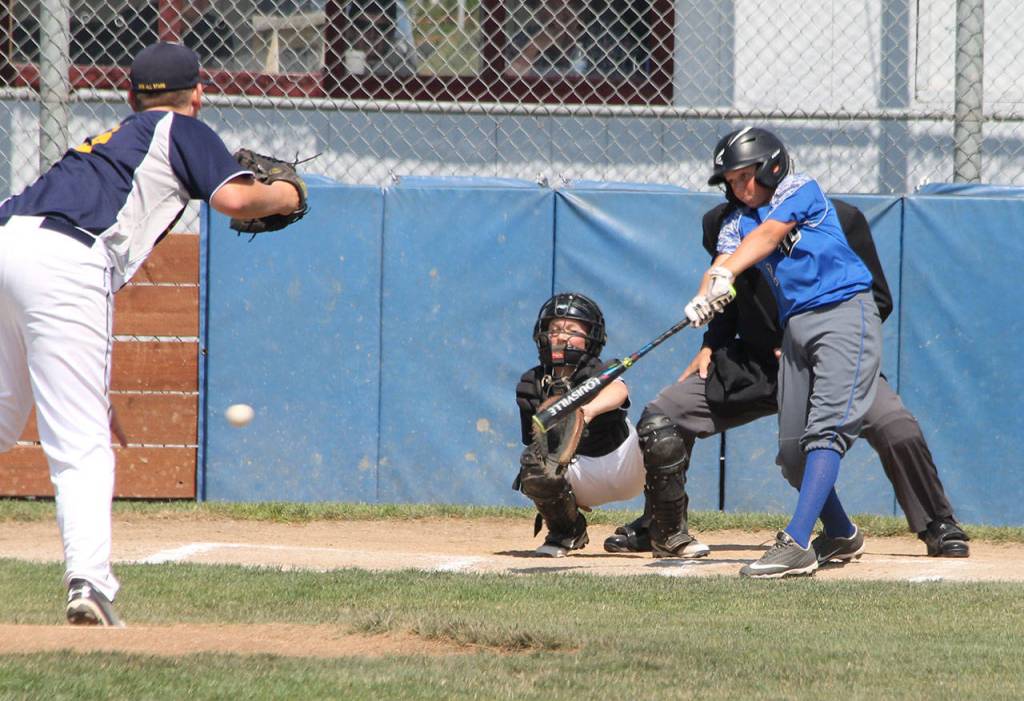 Grady Davis drives the ball through the right side for South Whidbeys only hit.(Photo by Jim Waller/South Whidbey Record)