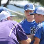 Coach Steve Zarifis meets on the mound with his infield during Saturdays game with Burlington.(Photo by Jim Waller/South Whidbey Record)