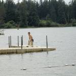 Photo by Jessie Stensland / South Whidbey Record                                Jack Baars pulls himself up on a float at Deer Lake after taking a swim earlier this month. He said the water was perfect.