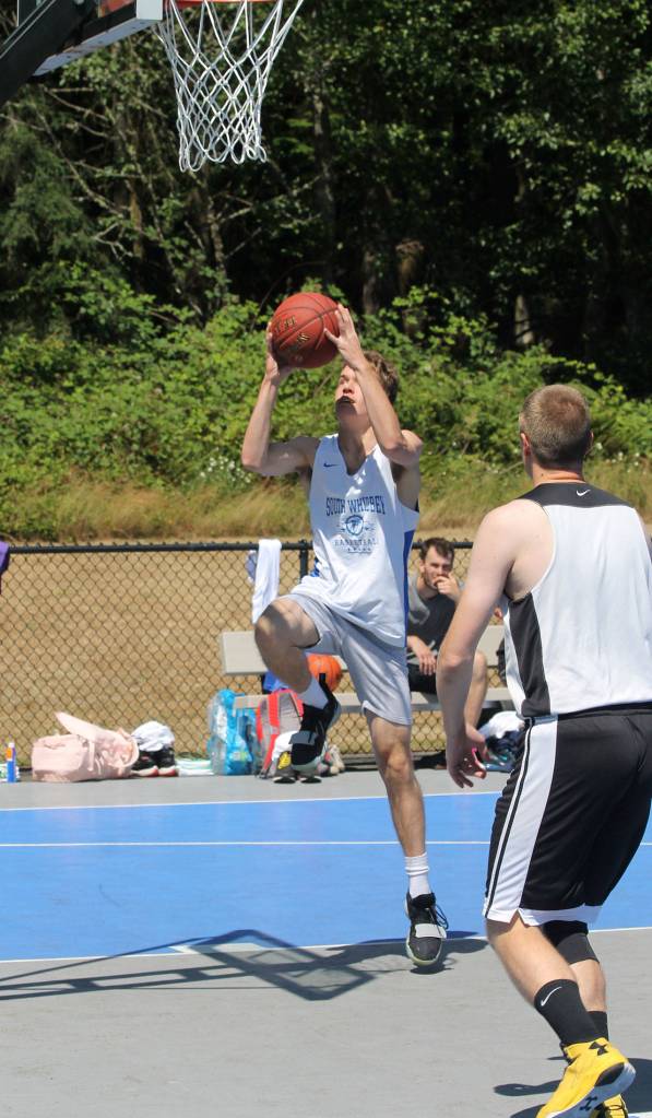 Nick Young gets loose for a lay-up. Young, who played for the Falcons, went on to win the tournament three-point contest. (Photo by Jim Waller/South Whidbey Record)