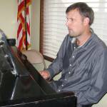 Jazz/classical pianist Rich Pellegrin sits at the concert grand piano at Langley United Methodist Church. Photos by Dave Felice