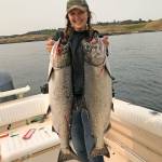 Kelsey Miranda shows off two salmon she caught last year. Photo provided