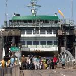 Walk-on passengers disembark from the ferry Suquamish at the Mukilteo ferry dock on Tuesday. The Washington State Transportation Commissioners has approved all of the proposed ferry rate increases for passengers and cars. (Andy Bronson / The Herald )