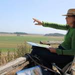 The scenic view of Ebeys Reserve serves as inspiration for watercolor artist Susan Payne, who participated in this weeks paint out events leading up to the Whidbey Plein Air exhibition this weekend. Photo by Maria Matson/Whidbey News Group