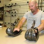 Military veteran Sherman Smitty Smith examines Japanese samurai warrior stirrups dating back centuries. Photo by Wendy Leigh/South Whidbey Record
