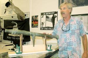 Picker John Norris shows off circa 1600s cannon discovered in abandoned storage locker. Photo by Wendy Leigh/South Whidbey Record