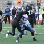 Wyatt De Mers makes a tackle in last years playoff game with Meridian. De Mers, a two-way, first-team all-league selection, returns this year to lead the Falcons. (Photo by Jim Waller/South Whidbey Record)