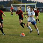 Alison Papritz (white jersey), the Falcons leading scorer, returns for the 2019 season. (Photo by Jim Waller/South Whidbey Record).