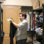Photo by Laura Guido/Whidbey News-Times                                Nathan Crisafulli, 24, helps put away donated clothing thats available to young people staying at Ryans House for Youth or those who visit the drop-in center.
