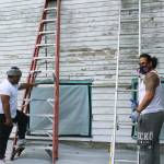 Workers Mason Tau, right, and Barry Brown, left, begin restoration project at Bayview Community Hall in Sept. 2019 after community meets its fundraising goal