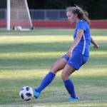 Lila McCleary boots the ball for the Falcons. (Photo by John Fisken)