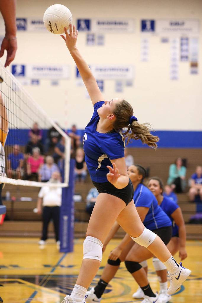 Kamryn Wilson uses a tip to attack for South Whidbey.(Photo by John Fisken)