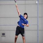 Ben Roughsedge fires a serve in second doubles.(Photo by John Fisken)