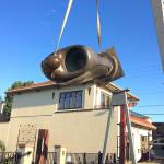 Photo provided by Rob and Victory Schouten                                The Giver sculpture gets hoisted into place at the new Rob Schouten Gallery and Sculpture Garden in Langley.