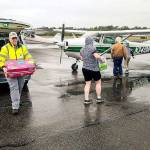 Clallam County Disaster Airlift Response Team load supplies into an airplane during an exercise at Bellingham International Airport last year. This is the first year that Community Emergency Response Team members from Whidbey are participating in the regional drill. (Photo by Tara Terry, provided by NW Regional Emergency Services)