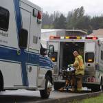 Emergency responders load injured patients into WhidbeyHealth ambulances and paramedic units after the Sept. 17 collision along Highway 525. (Photo by Wendy Leigh/South Whidbey Record)