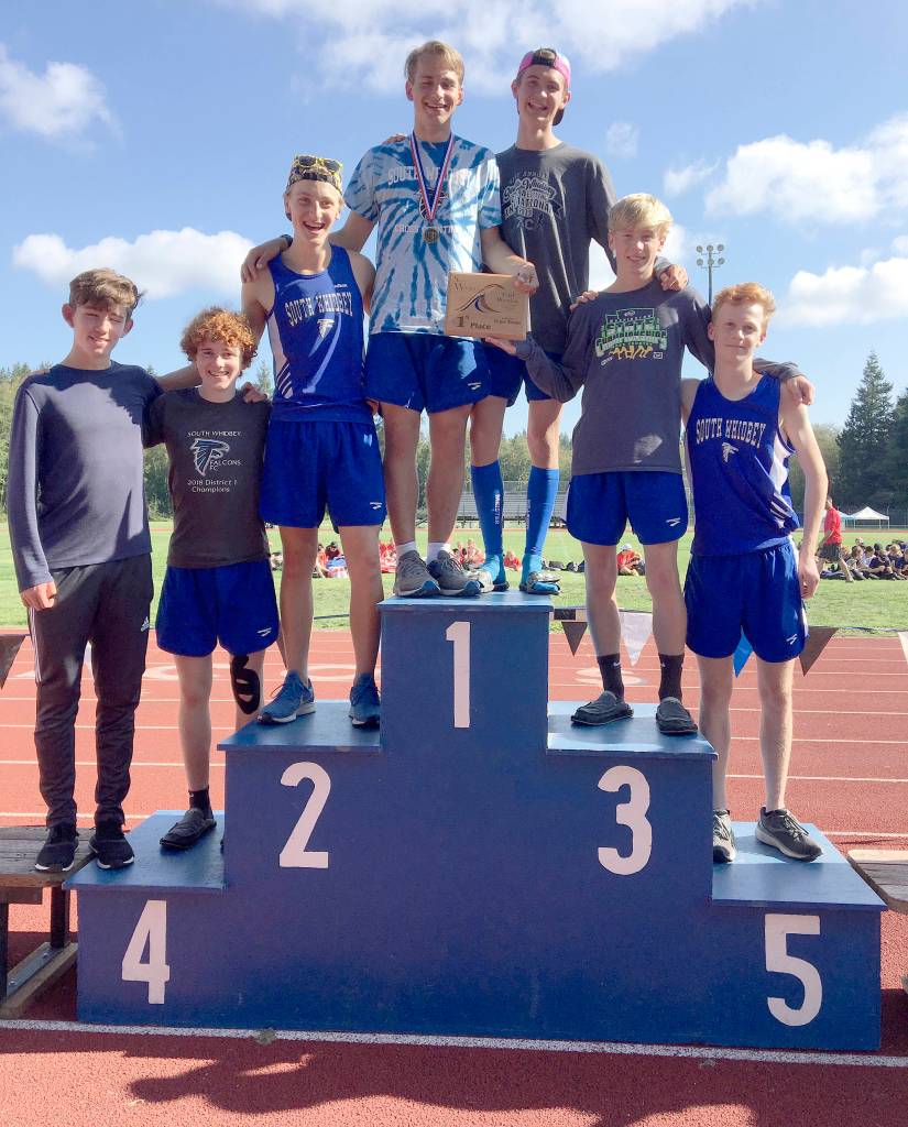 The South Whidbey High School boys cross country team receives its first-place award Saturday. From the left are Aidan OBrien, Aidan Donnelly, Cooper Ullmann, Michael Harwell, Preston Leon, Thomas Simms and Reilly McVay. (Photo by Matt Simms)