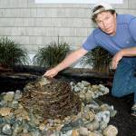Stone and rock artist Rick Hahn prepares an artisan water fountain for the Whidbey Island Grown Week open studio hosted by himself and fellow artist/wife Rayna Hahn. Photo by Wendy Leigh/South Whidbey Record.