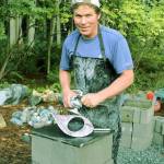 Artisan Rick Hahn creates a natural stone sculpture at the Earth2Art Studio shared with his wife, wood sculpture artist Rayna Hahn. The couple is hosting an open-studio afternoon for Whidbey Island Grown Week. Photo by Wendy Leigh/ Whidbey News Group