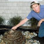 Stone and rock artist Rick Hahn from Earth2Art Studio prepares an artisan water fountain for the Whidbey Island Grown Week open studio hosted by himself and fellow artist/wife Rayna Hahn. Photo by Wendy Leigh/Whidbey News Group
