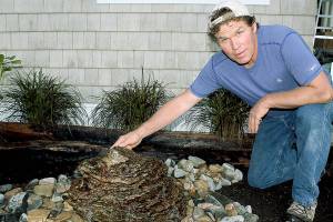 Stone and rock artist Rick Hahn from Earth2Art Studio prepares an artisan water fountain for the Whidbey Island Grown Week open studio hosted by himself and fellow artist/wife Rayna Hahn. Photo by Wendy Leigh/Whidbey News Group