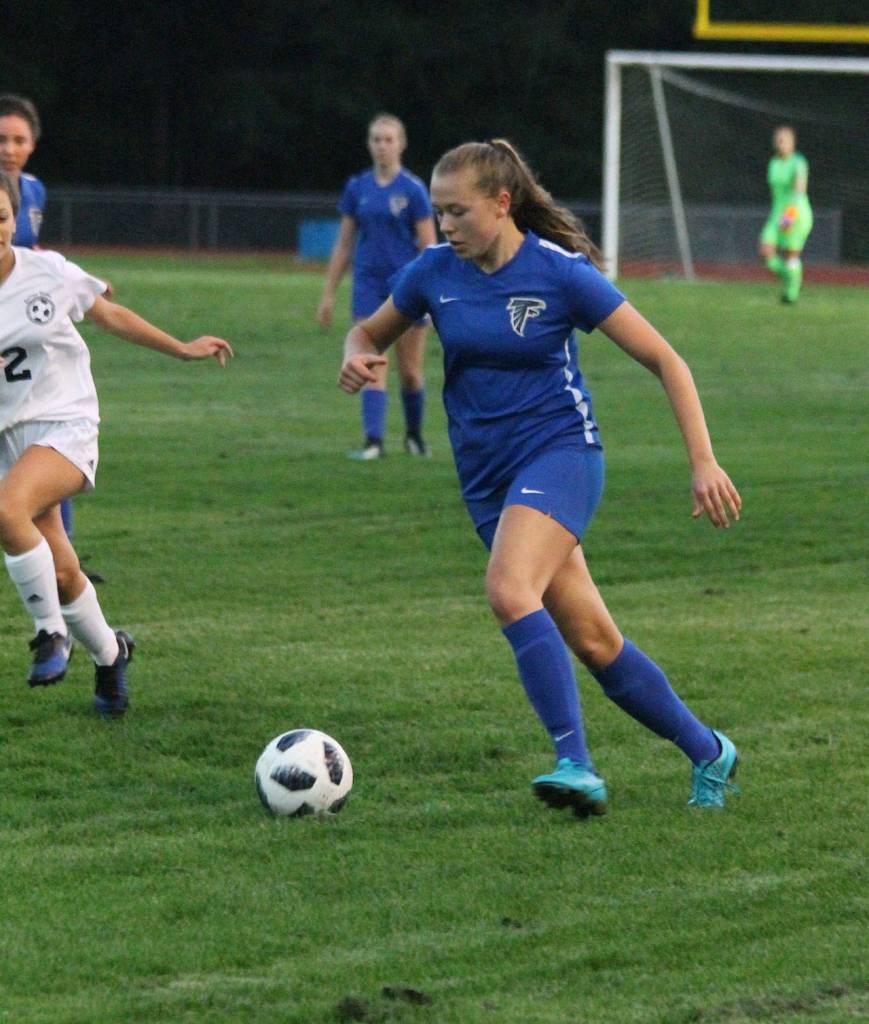 Lila McCleary dribbles by the Turk defense. (Photo by Jim Waller/South Whidbey Record)