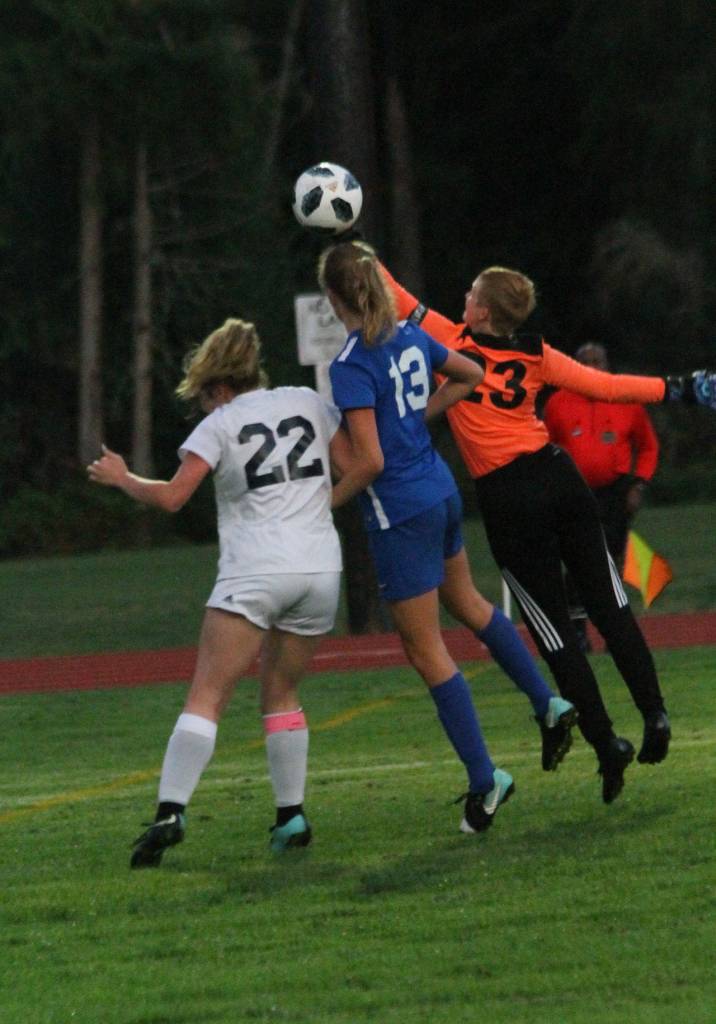 South Whidbeys Juliana Larson-Wickman (13) tries to head in a goal around Sultans Kennedy Wolff (22) and Amanda McKay.(Photo by Jim Waller/South Whidbey Record)