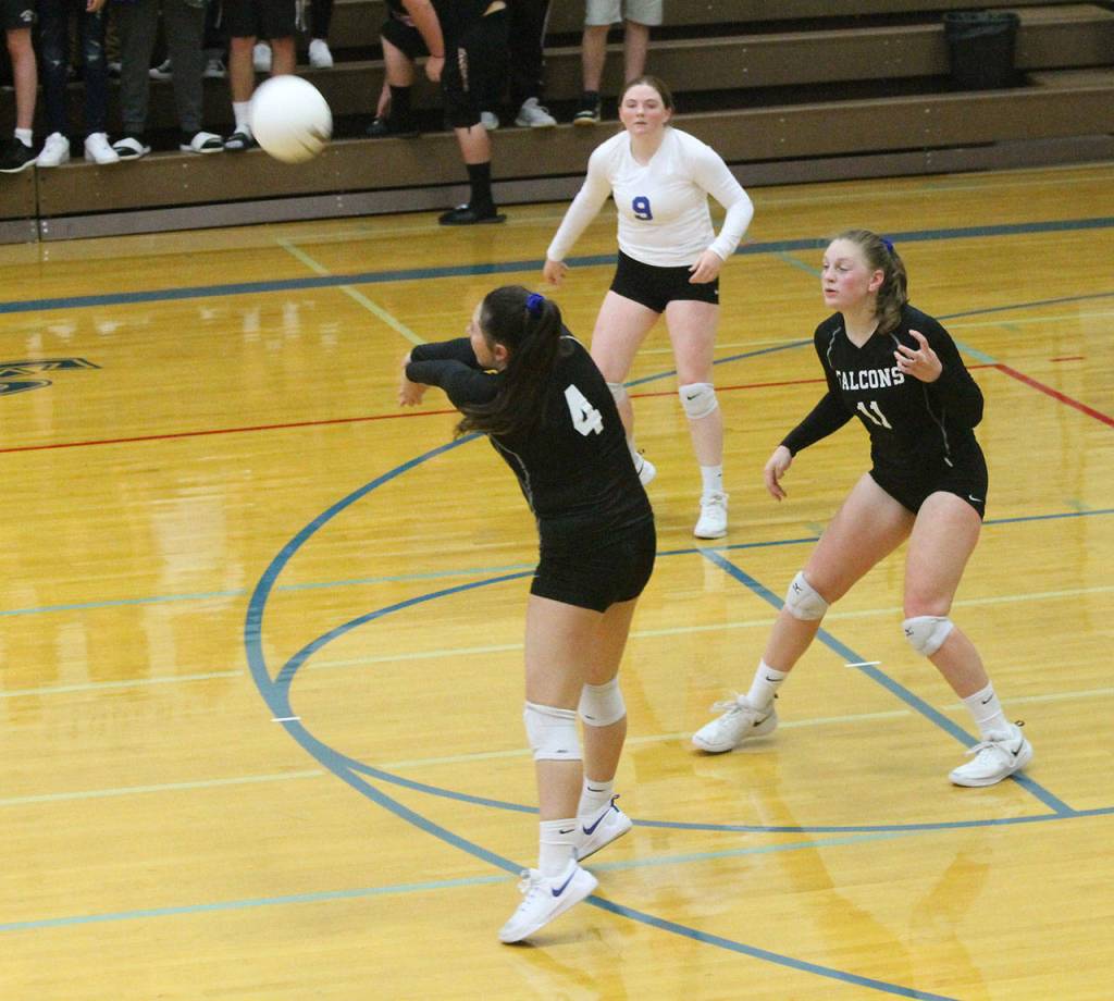 Madi Knauer (4) passes as Emma Hodson, right, and Kayla Knauer look on.(Photo by Jim Waller/South Whidbey Record)