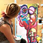 A participant learns about process painting during a previous three-day workshop. Photo provided